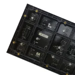 Black circuit board featuring various electronic components and connectors arranged in a grid pattern.