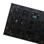Black circuit board featuring multiple integrated circuits and connectors arranged in a grid pattern.
