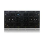 Black circuit board featuring various electronic components and connectors arranged in a grid layout.