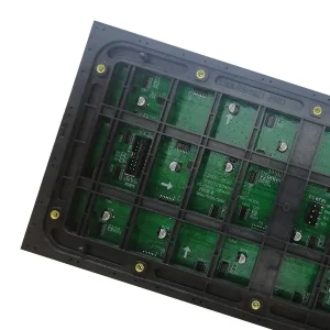 Close-up view of a circuit board featuring green electronic components and connectors.