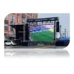 Large outdoor LED screen showing a live soccer match with players on the field.