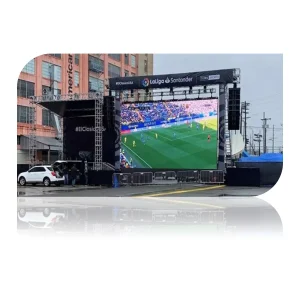 Large outdoor LED screen showing a live soccer match with players on the field.