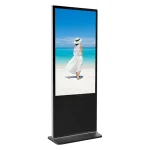 Digital display stand featuring a woman in a white dress walking on a beach.