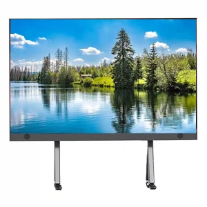Digital display screen featuring a serene lake and forest landscape with clear blue skies.
