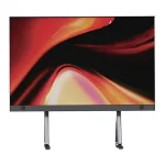 Flat screen television with a vibrant abstract display featuring red and orange colors.