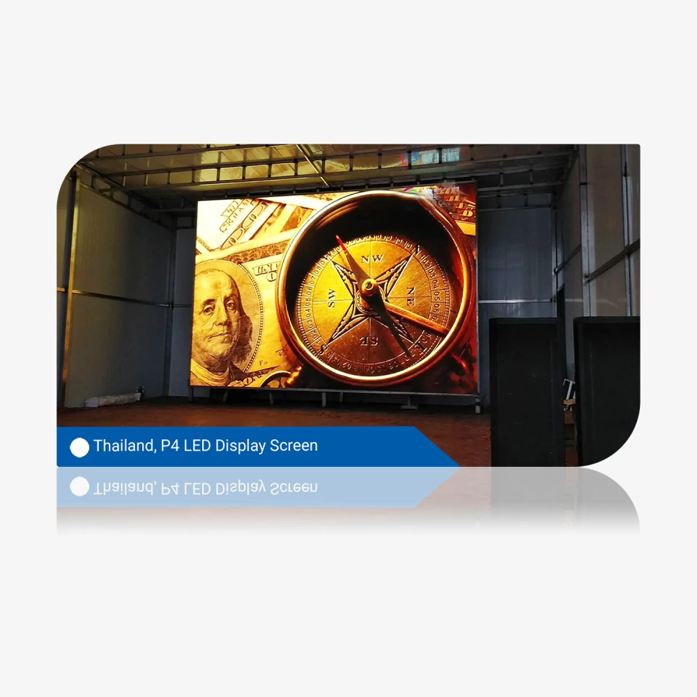P4 LED display screen featuring a compass and currency design in a warehouse setting.