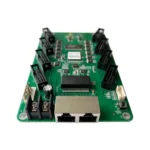 Green circuit board featuring multiple connectors and electronic components.