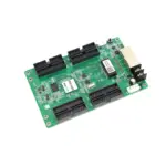 Green circuit board featuring various connectors and a network port for electronic devices.