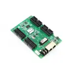 Green circuit board featuring multiple connectors and a network port.