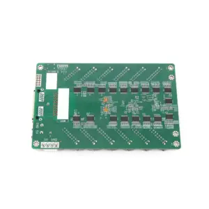 Green printed circuit board featuring various electronic components and connections.