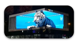 Digital billboard featuring a white tiger with a blue background and a small bird.