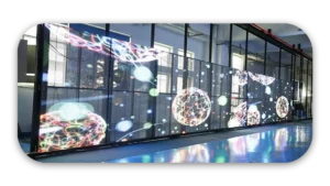 Large digital screen displaying colorful abstract patterns and shapes in a modern setting.