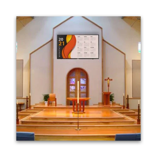 2021 calendar mounted on a wall inside a church with wooden interior.