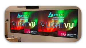 Large LED display showcasing the Aurora logo and LightVU branding at Simon Fraser University.