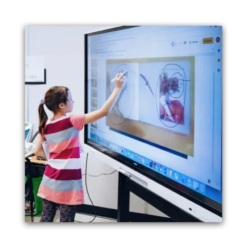 Young girl drawing on an interactive display in a classroom setting.